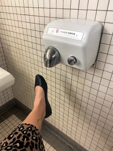 drying wet shoes under a hand dryer