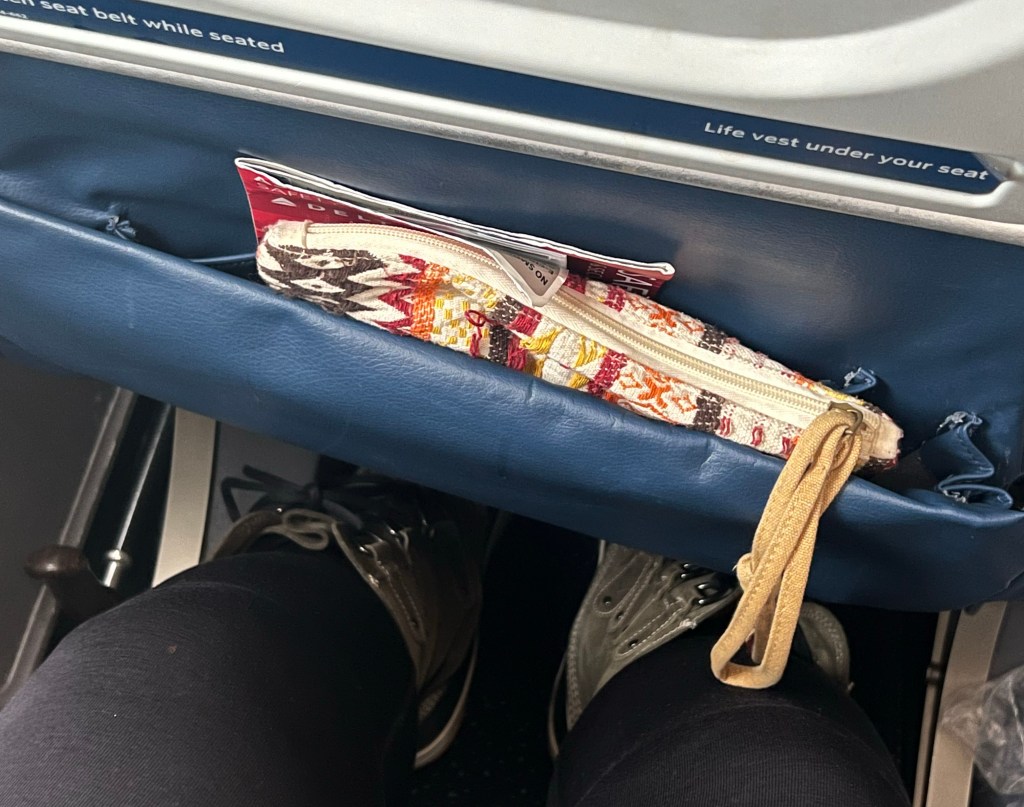 my plane bag for my long haul flight to Norway, in the seat back pocket of a Delta flight